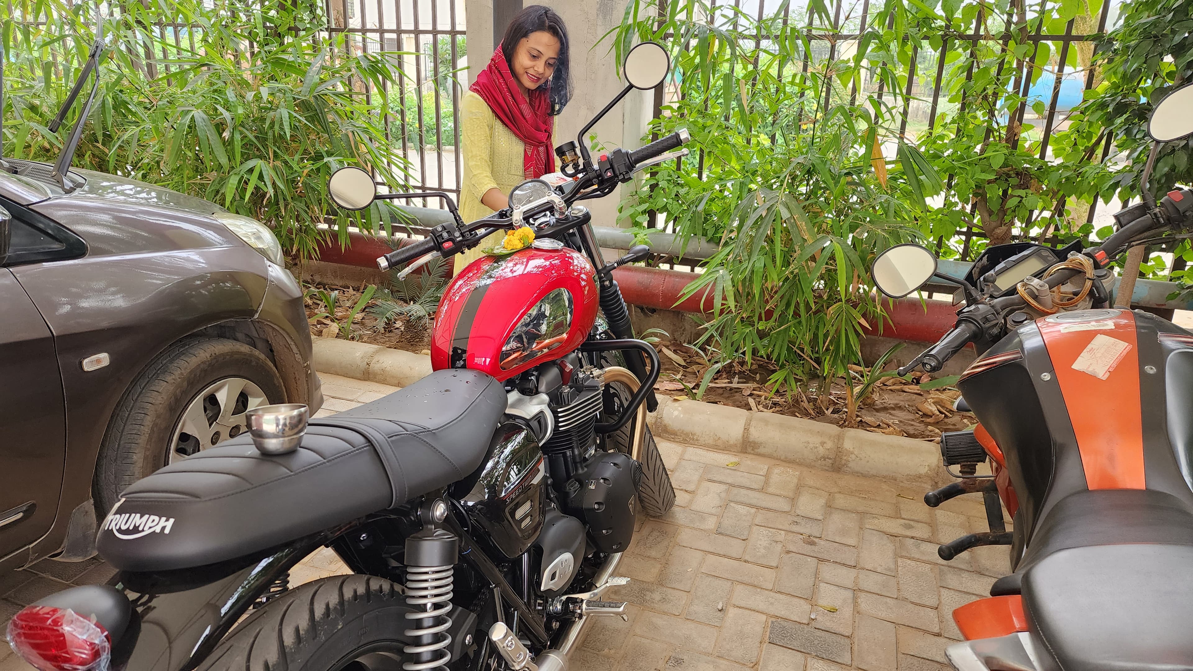 Wife performing the welcoming rituals for the Speed Twin on 17th March { w: 600, h: 400 }